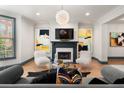Inviting living room featuring a fireplace, plush seating, and contemporary artwork at 190 Centennial Way, Atlanta, GA 30313