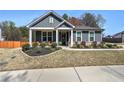 A cozy home with a beautiful lawn and inviting front porch perfect for relaxing at 34 Mountainbrook Nw Dr, Cartersville, GA 30121
