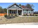 Charming single story home featuring a welcoming front porch and beautifully landscaped yard at 34 Mountainbrook Nw Dr, Cartersville, GA 30121