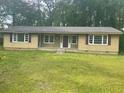 Single-story home with a well-maintained lawn and inviting curb appeal at 4734 Lawrenceville Hwy, Tucker, GA 30084