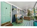 Inviting front porch with a colorful door, cozy seating, and a warm welcome to the home at 3020 Parkridge Ne Dr, Brookhaven, GA 30319