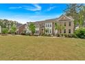 Well-manicured lawn and attractive townhouses offer picturesque suburban living at 2066 Patterson Park Rd, Decatur, GA 30033