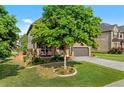 Attractive brick home with covered porch and lush landscaping creating a welcoming curb appeal at 1212 Overlook Lake Dr, Dacula, GA 30019