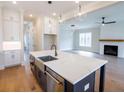 Bright kitchen boasts a center island, open to living area with fireplace at 1415 Coretta Bnd, Atlanta, GA 30318