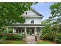 Charming two-story home with a classic front porch, landscaped yard, and inviting curb appeal at 872 Euclid Ne Ave, Atlanta, GA 30307