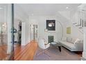 Bright living room with hardwood floors, a fireplace, and a staircase, perfect for entertaining at 872 Euclid Ne Ave, Atlanta, GA 30307
