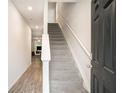 Welcoming entryway with a staircase, neutral walls, and durable wood-look flooring at 3565 Brycewood Dr, Decatur, GA 30034
