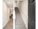 Bright entry hallway with stairs and views into the living area at 3565 Brycewood Dr, Decatur, GA 30034