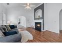 Open living room featuring fireplace, vaulted ceilings, and cozy furnishings at 6045 Park Close, Fairburn, GA 30213