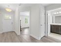 Bright entryway featuring wood floors and views into the bedroom and bathroom at 52 Lantern Trce, Hiram, GA 30141