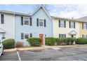 Exterior shot of home displaying landscaping, parking, and colorful front door at 2859 Spring Villa Se Ln, Smyrna, GA 30080