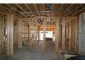 Interior view showcasing the wooden frame construction of the new home at 214 Wild Ginger Bnd, Woodstock, GA 30188
