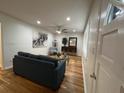 Comfortable living room with hardwood floors, stylish decor, and ample natural light at 2833 Oldknow Nw Dr, Atlanta, GA 30318