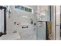 Modern bathroom featuring a glass shower with marble-look walls and sleek fixtures at 31 Fairview Oak Cv, Dallas, GA 30157