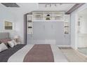 Cozy bedroom featuring built-in storage, murphy bed, and neutral color palette at 620 Peachtree Ne St # 601, Atlanta, GA 30308