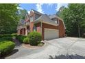 Beautiful brick home features an attached garage and well-maintained landscaping at 4810 Duncans Lake Dr, Buford, GA 30519