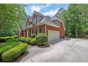 Beautiful two-story brick home showcasing an attached garage and a well-maintained yard at 4810 Duncans Lake Dr, Buford, GA 30519