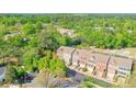 A scenic aerial view of the townhome community surrounded by lush trees and greenery at 12084 Cotton Aly, Alpharetta, GA 30009