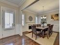 Elegant dining room with hardwood floors, fireplace, and wainscoting at 4892 Kentwood Dr, Marietta, GA 30068