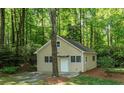 Charming cottage-style home nestled in a lush, green wooded area offers peace and privacy at 3078 Alberta Dr, Marietta, GA 30062