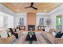 Cozy living room with a wood-paneled ceiling, fireplace, and stylish decor at 3267 Sewell Mill Rd, Marietta, GA 30062