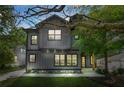 Two-story home featuring a modern gray exterior and a well-manicured lawn at 34 Candler Ne Rd, Atlanta, GA 30317