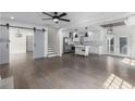 Open living space showcases hardwood floors, white kitchen, and modern design, perfect for entertaining and Gathering living at 1334 Milton Se Pl, Atlanta, GA 30316