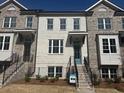 Charming brick townhome with well-manicured front yard and inviting entrance at 3167 Moor View Rd # 35, Duluth, GA 30096