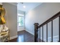 Bright foyer with hardwood floors, staircase, and access to the home's main living areas at 2048 Rockledge Ne Rd, Atlanta, GA 30324