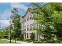 Charming townhome exterior showcases meticulous landscaping and classic architectural details, creating a welcoming curb appeal at 2048 Rockledge Ne Rd, Atlanta, GA 30324