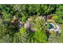 Aerial view of estate featuring a pool, mature trees, and lush landscaping at 3086 E Pine Valley Nw Rd, Atlanta, GA 30305