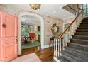 Grand foyer features hardwood floors, archways, staircase, and views into the dining room at 3086 E Pine Valley Nw Rd, Atlanta, GA 30305