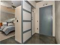 View of bedroom and hallway showcases ceiling fan, door, and frosted glass sliding doors at 480 John Wesley Dobbs Ne Ave # 418, Atlanta, GA 30312