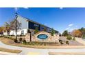 Stone Harbor Landing community entrance sign with blue siding on homes at 6348 Lanier Harbor Lndg, Buford, GA 30518