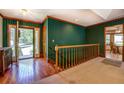 Inviting entryway with hardwood floors and striped wallpaper, featuring a view into the living spaces at 2903 Southpark Sw Ter, Conyers, GA 30094