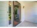 Close-up view of the front porch with sliding glass door and white siding at 2903 Southpark Sw Ter, Conyers, GA 30094