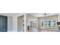 Spacious living room with hardwood floors, open to the dining and kitchen areas with great natural light at 170 Paislee Park (Lot #8 Paislee Park) Dr, Fayetteville, GA 30215