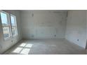Bright bedroom with large windows, offering natural light and views, awaiting personalization and finishing touches at 2093 Boxwood Se Cir, Conyers, GA 30094