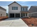 New construction home featuring a spacious two-car garage and a charming front porch, ready for customization at 2093 Boxwood Se Cir, Conyers, GA 30094