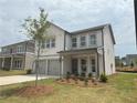 Charming two-story home featuring a two-car garage and well-maintained lawn at 2093 Boxwood Se Cir, Conyers, GA 30094