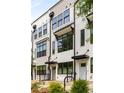 Beautiful townhome row featuring modern design, clean lines, and black framed windows at 1265 Wright Se Ln, Atlanta, GA 30316