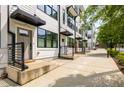 Townhome exteriors featuring covered entryways and modern railings, creating an inviting street appeal at 1265 Wright Se Ln, Atlanta, GA 30316