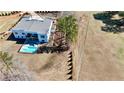 Aerial view of a modern house with a backyard pool, patio, and meticulous landscaping on a large lot at 292 Highway 279, Fayetteville, GA 30214