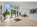 Bright foyer featuring soaring ceilings, modern chandelier, and oversized windows overlooking the front yard at 292 Highway 279, Fayetteville, GA 30214
