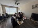 Bright living room featuring vinyl plank flooring and a large window for natural light at 229 Odyssey Turn, Conyers, GA 30012