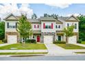 Attractive townhomes boast colorful accents, stone facade, and well manicured lawns and landscaping at 692 Oakside Pl, Acworth, GA 30102