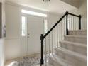 Bright entryway with stairs, tile flooring, and a white front door with sidelights at 4085 Chadds Walk, Marietta, GA 30062