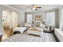 Inviting living room with modern decor, large sectional sofa, and stylish area rug at 2023 Yellow Finch Trl, Atlanta, GA 30316