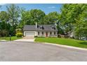 Charming home featuring a red front door, front porch and front lawn at 831 Terrace Trce, Lawrenceville, GA 30044