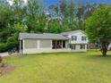 Well-maintained home with lawn, charming lattice accent, inviting front porch and a black motorcycle at 1448 Drayton Woods Dr, Tucker, GA 30084